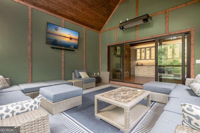 living room featuring high vaulted ceiling and wooden ceiling