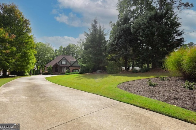 view of home's community with a lawn