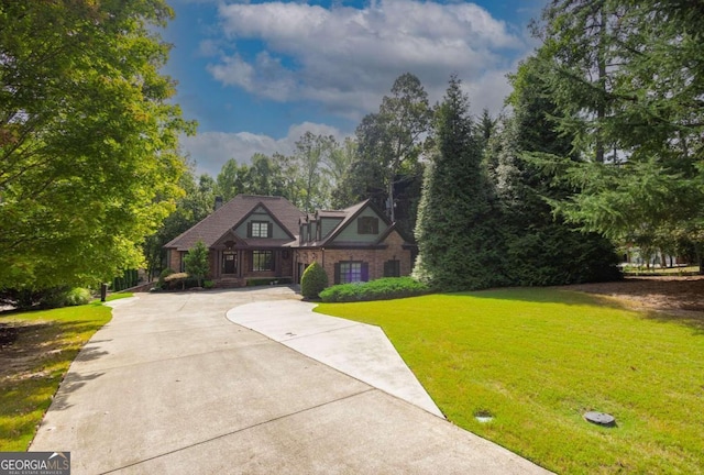 tudor house featuring a front lawn