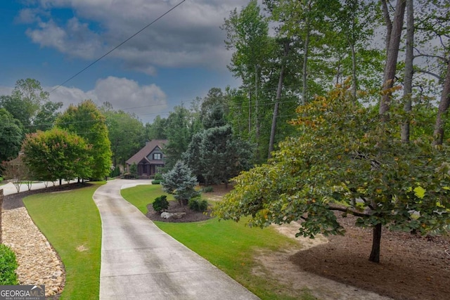 surrounding community featuring a lawn