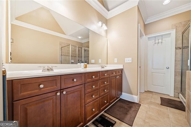 bathroom featuring vanity, tile patterned floors, ornamental molding, and an enclosed shower