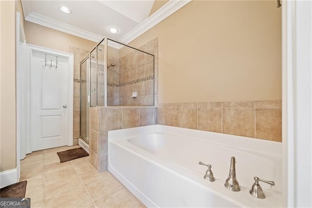 bathroom featuring tile patterned flooring, crown molding, and shower with separate bathtub