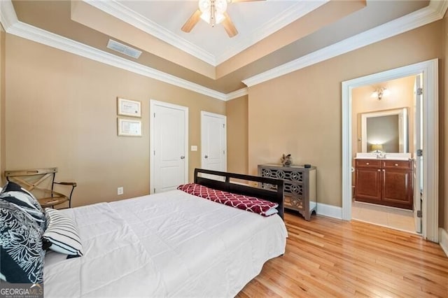 bedroom with ornamental molding, hardwood / wood-style flooring, and ceiling fan