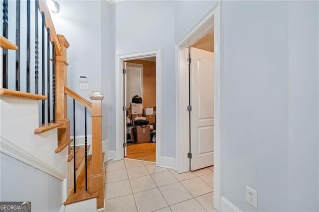 hallway with light tile patterned floors