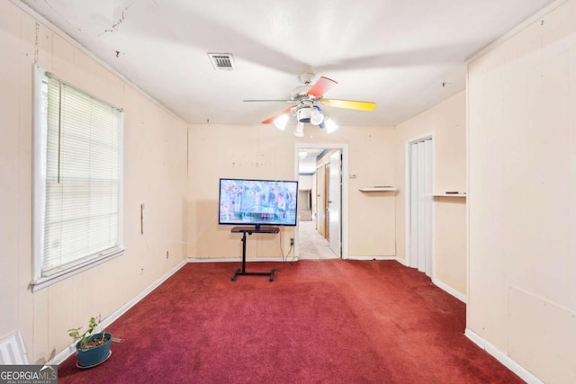 carpeted empty room with ceiling fan