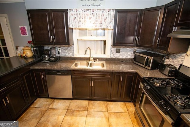 kitchen featuring sink, appliances with stainless steel finishes, light tile patterned floors, and tasteful backsplash