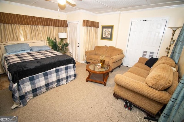 carpeted bedroom with ceiling fan and crown molding