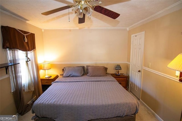 carpeted bedroom with crown molding, a textured ceiling, and ceiling fan