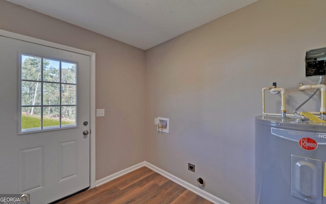 laundry area with hookup for an electric dryer, water heater, a healthy amount of sunlight, and dark hardwood / wood-style flooring