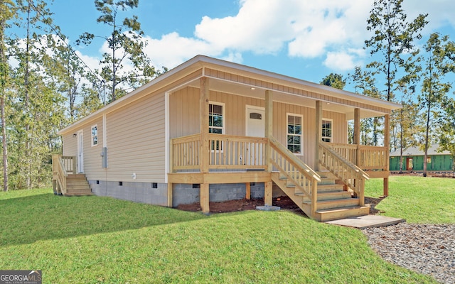 view of front facade with a front yard and a porch