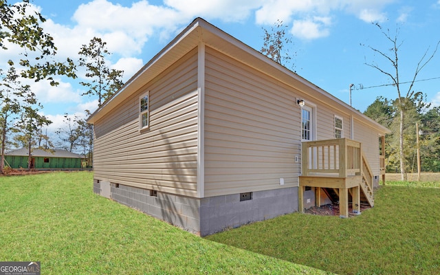 view of side of home featuring a yard