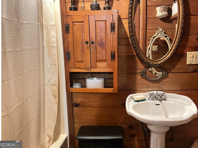 bathroom with wooden walls