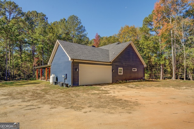 view of property exterior with a garage