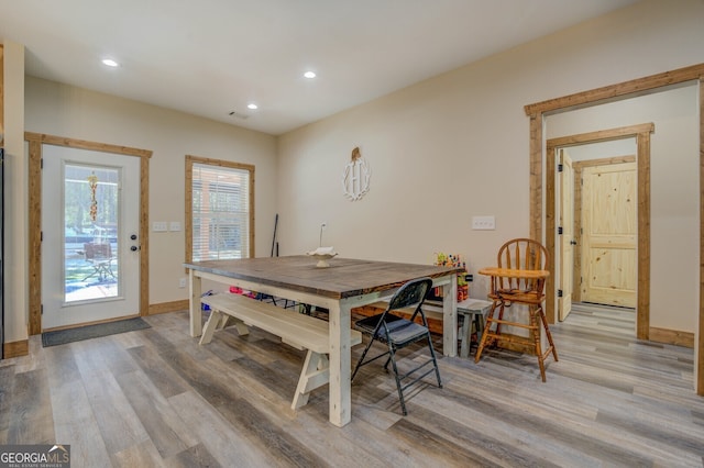 dining space with light wood-type flooring