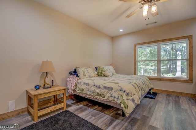 bedroom featuring dark hardwood / wood-style floors and ceiling fan