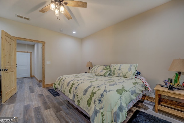 bedroom with ceiling fan and wood-type flooring