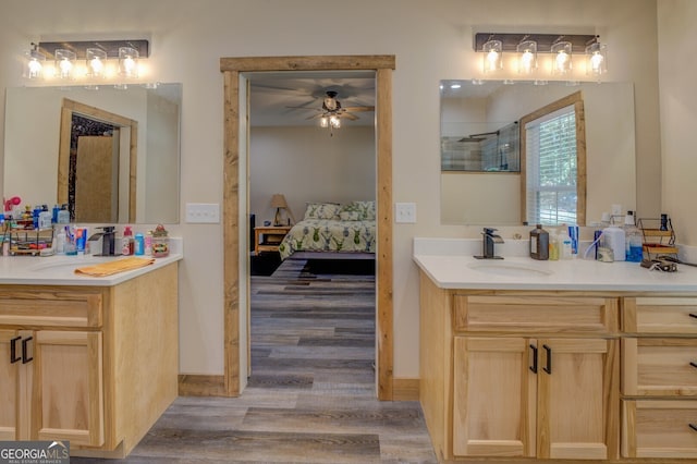 bathroom featuring vanity, a tile shower, hardwood / wood-style flooring, and ceiling fan