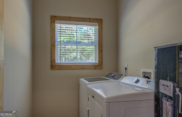 laundry room featuring washing machine and clothes dryer