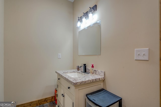 bathroom featuring vanity and wood-type flooring