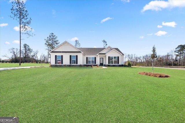 single story home featuring a front yard