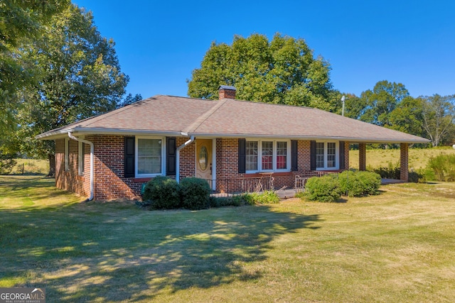 ranch-style home with a front lawn