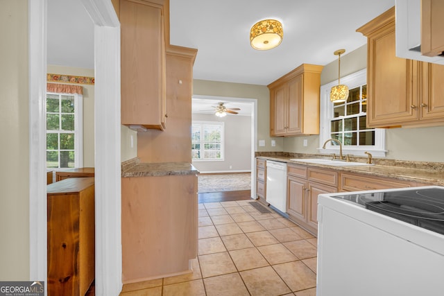 kitchen featuring light tile patterned flooring, sink, light brown cabinetry, and white appliances