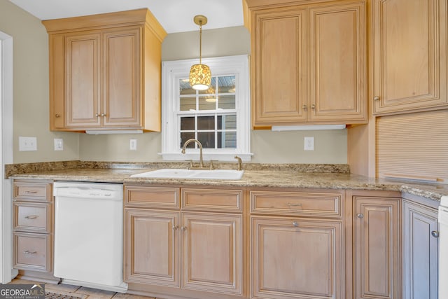 kitchen with sink, light stone countertops, dishwasher, and pendant lighting