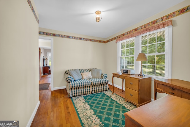 living area with light hardwood / wood-style flooring