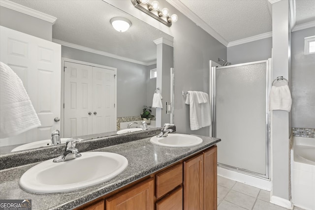 bathroom with shower with separate bathtub, a textured ceiling, tile patterned floors, vanity, and ornamental molding