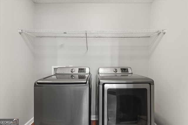 laundry room featuring washer and clothes dryer