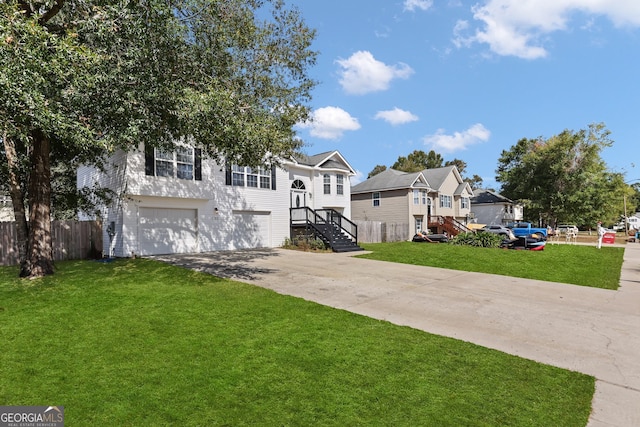 bi-level home featuring a front yard and a garage