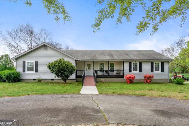 ranch-style house with covered porch and a front lawn