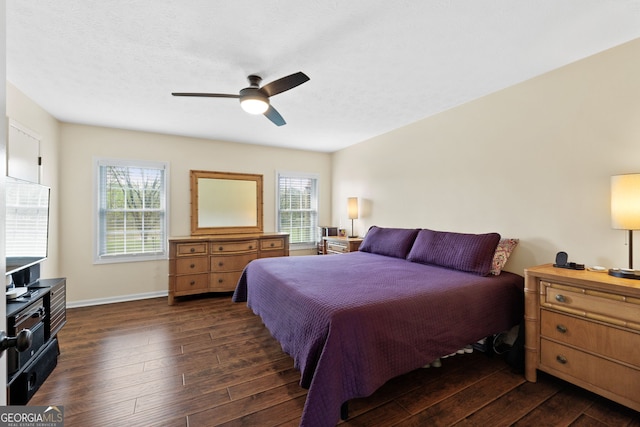 bedroom featuring dark hardwood / wood-style floors and ceiling fan