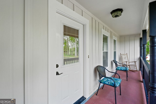 doorway to property featuring a porch