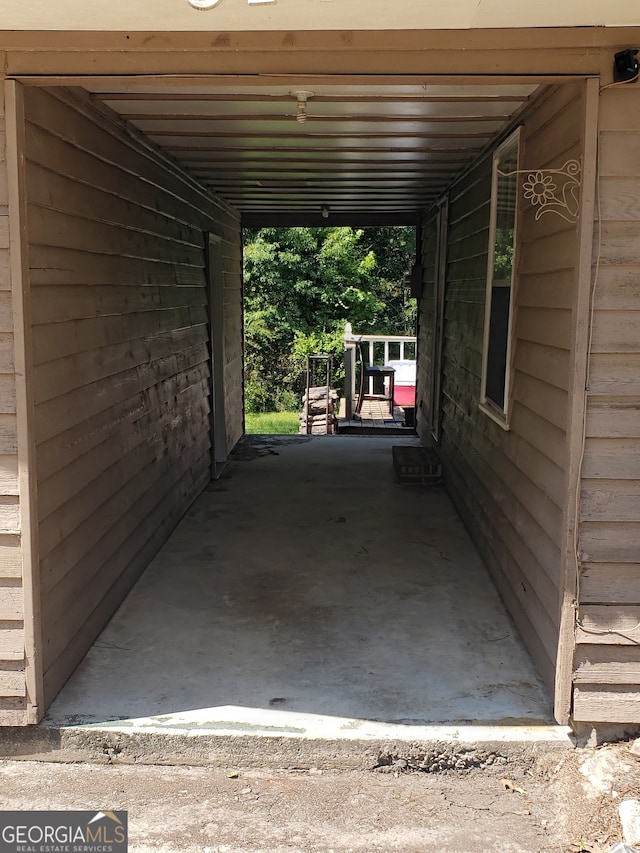 view of parking / parking lot featuring a carport