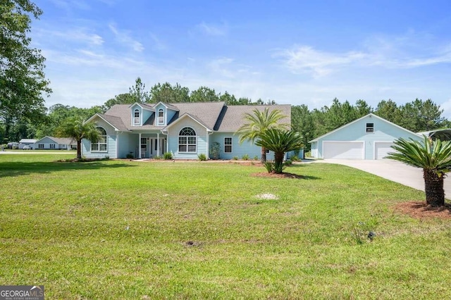 view of front of home with a front yard, covered porch, and a garage