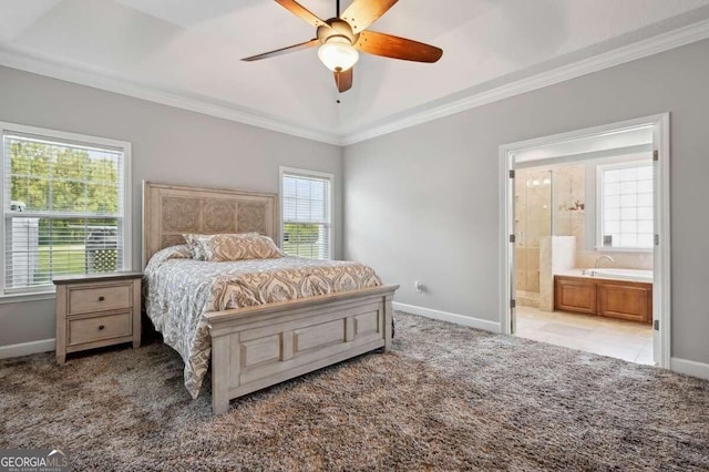 carpeted bedroom with connected bathroom, crown molding, multiple windows, and ceiling fan