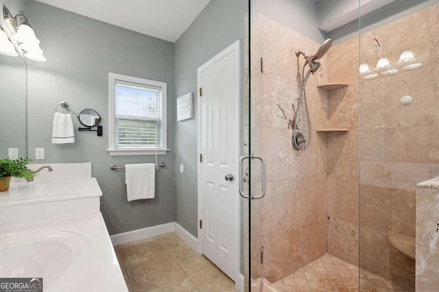 bathroom with vanity, an enclosed shower, and tile patterned floors