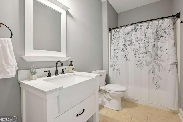 bathroom featuring vanity, a shower with shower curtain, toilet, and tile patterned floors