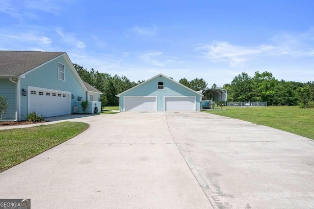 view of front of home with a front yard and a garage