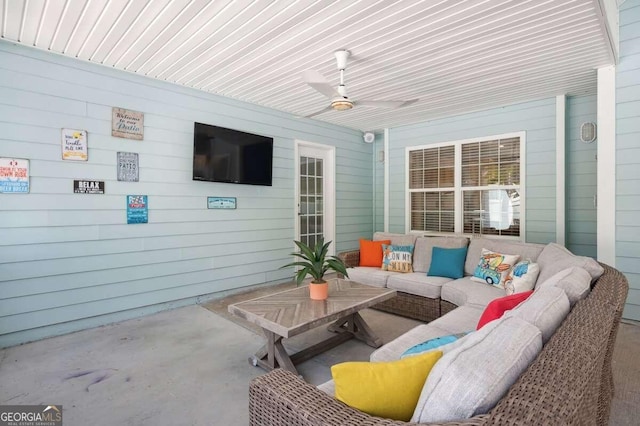 view of patio featuring an outdoor living space and ceiling fan