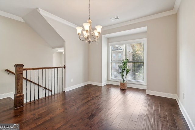 unfurnished room featuring crown molding, a notable chandelier, and dark wood-type flooring