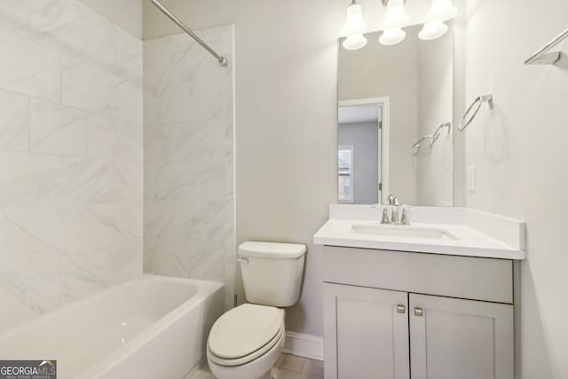 full bathroom with vanity, toilet, and tiled shower / bath