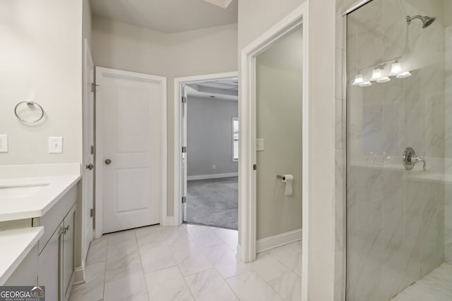 bathroom with a shower with door and vanity