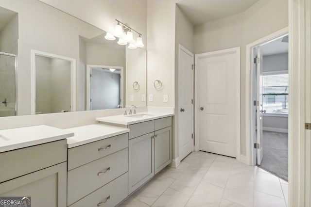 bathroom featuring vanity and an enclosed shower