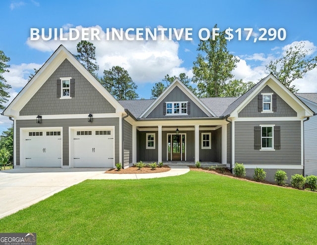 craftsman-style house with covered porch, a front yard, and a garage