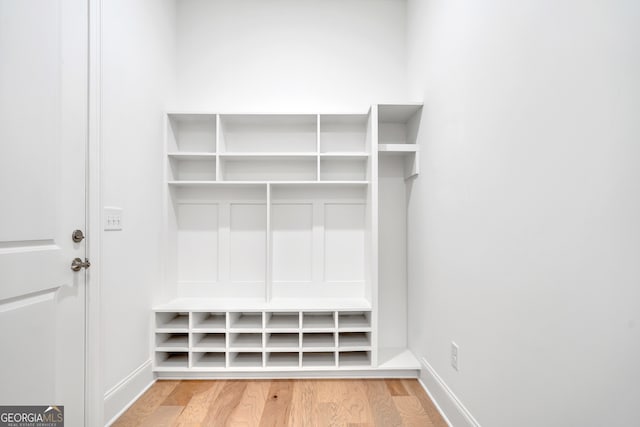 mudroom with hardwood / wood-style flooring