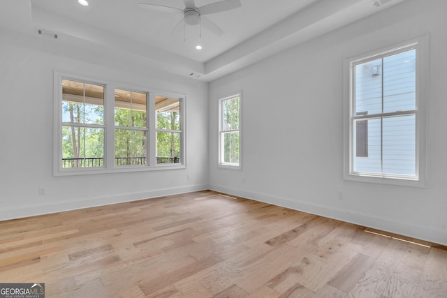 empty room with light hardwood / wood-style flooring and ceiling fan