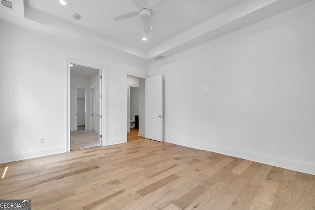 unfurnished bedroom with light wood-type flooring and ceiling fan