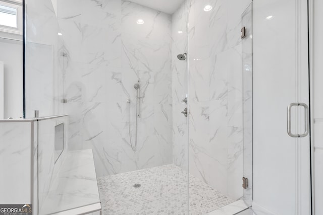 bathroom featuring an enclosed shower